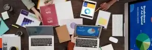 people sitting at a table working on marketing